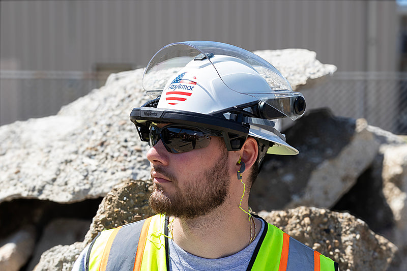Man wearing HexArmor TruSpan Universal Face Shield on a safety helmet