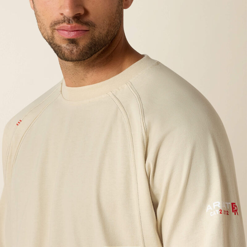 Close up of a man wearing ariat work crew t-shirt in beige