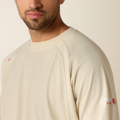 Close up of a man wearing ariat work crew t-shirt in beige