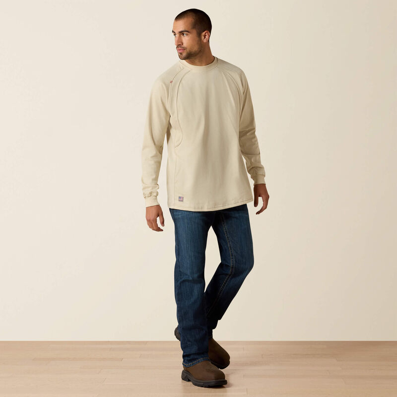 A man wearing ariat work crew t shirt in beige