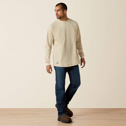 A man wearing ariat work crew t shirt in beige