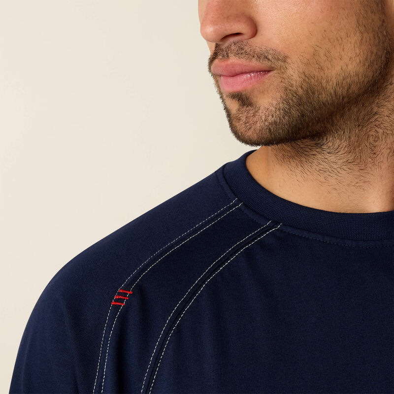 Close up of a man wearing ariat work crew t-shirt in navy