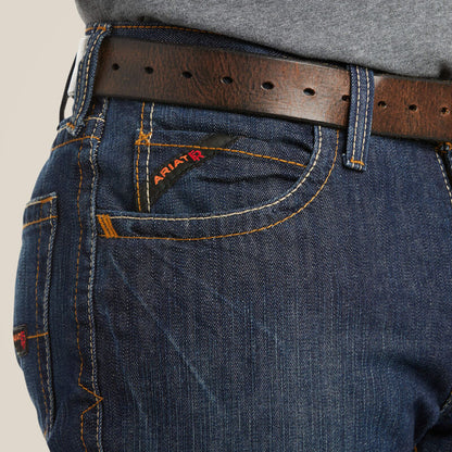 Person wearing Ariat M4 jeans with belt