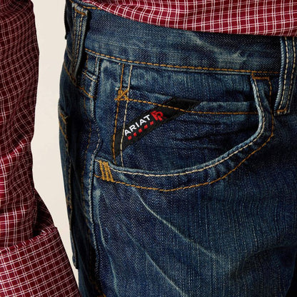 Close up of man wearing Ariat FR straight leg jean showing front pocket