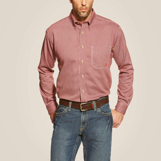 A man wearing Ariat button down FR work shirt in wine color