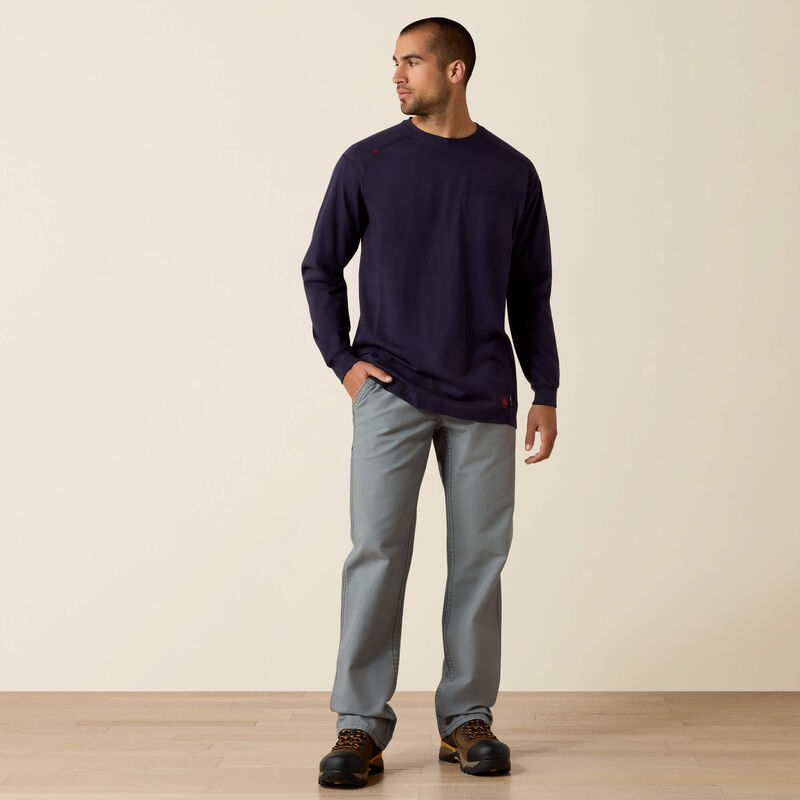 A man wearing Ariat FR Crew T-shirt in navy