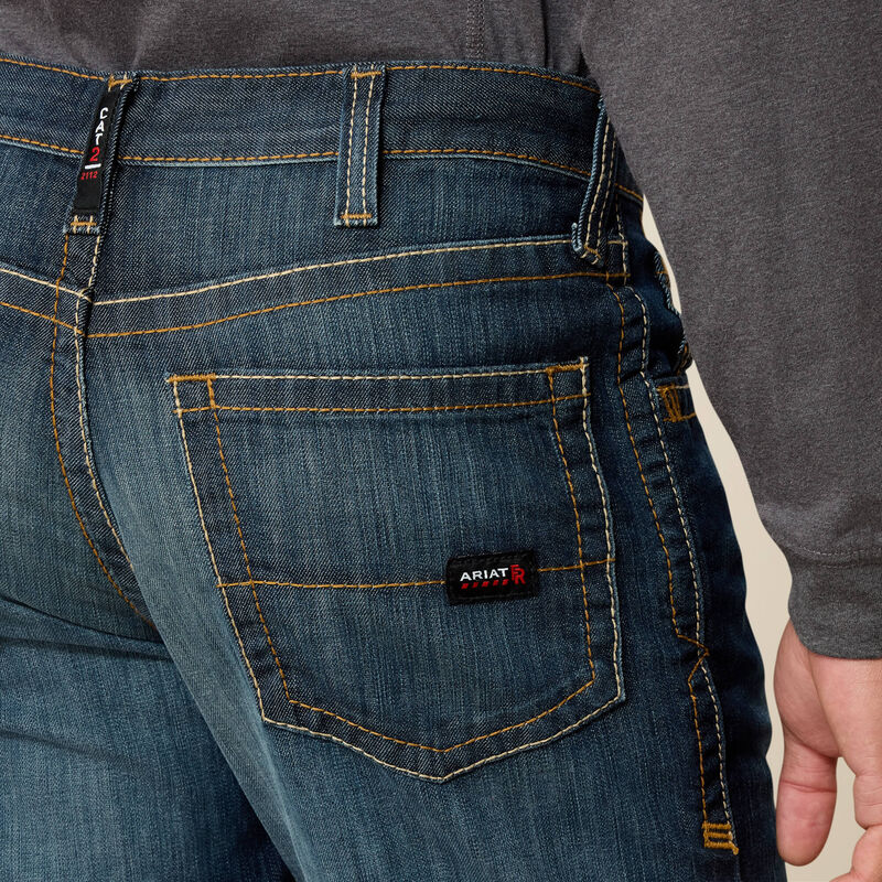 Close up of a man wearing Ariat FR duralight boot cut jean showing back pocket