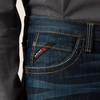 Close up of a man wearing Ariat FR duralight boot cut jean showing front pocket