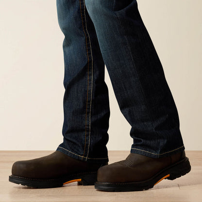 Close up of a man wearing Ariat FR duralight boot cut jean 