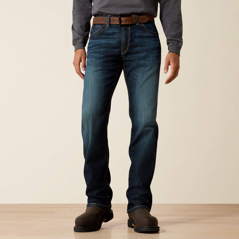 A man wearing Ariat FR duralight boot cut jean