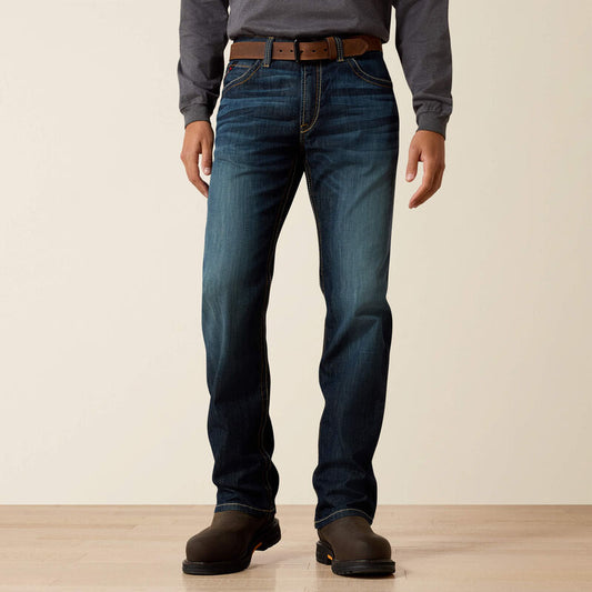 A man wearing Ariat FR duralight boot cut jean