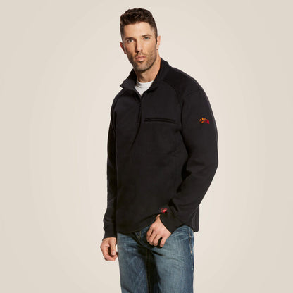 A man wearing ariat 1/4 zip FR pullover in black color