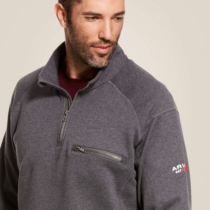 Close up of a man wearing ariat 1/4 zip FR pullover in grey color