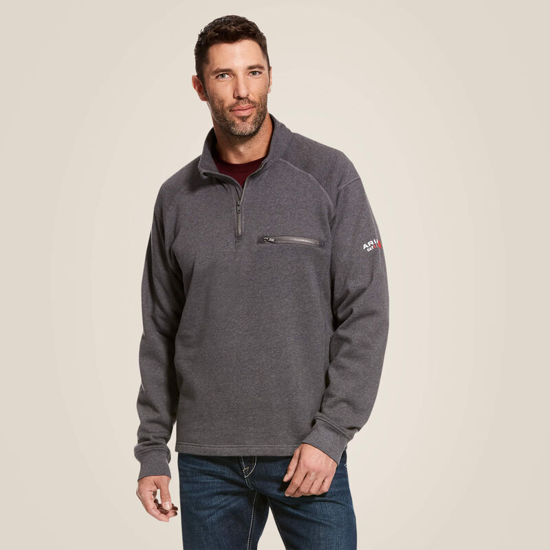 A man wearing ariat 1/4 zip FR pullover in grey color
