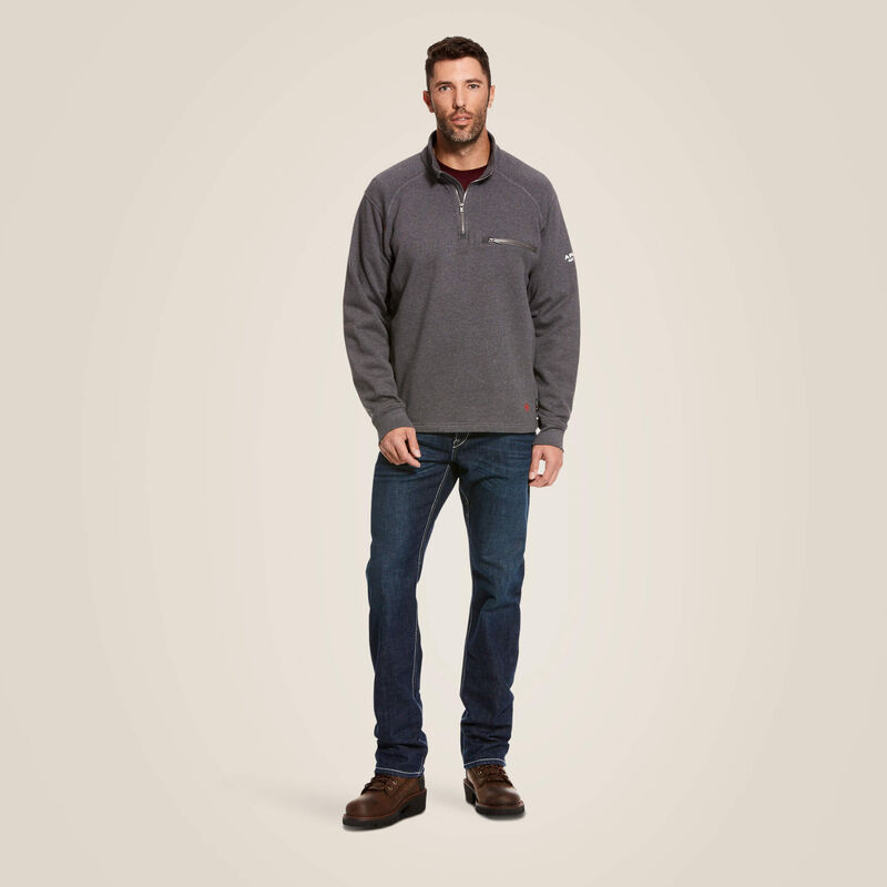 A man wearing ariat 1/4 zip FR pullover in grey color