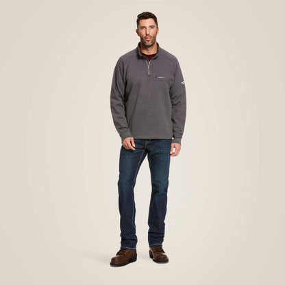 A man wearing ariat 1/4 zip FR pullover in grey color