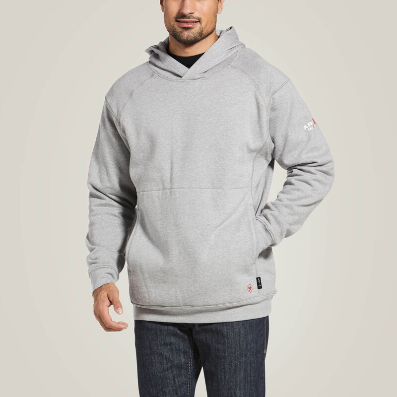 Zoomed in front view of a man wearing Ariat FR pullover hoodie in grey