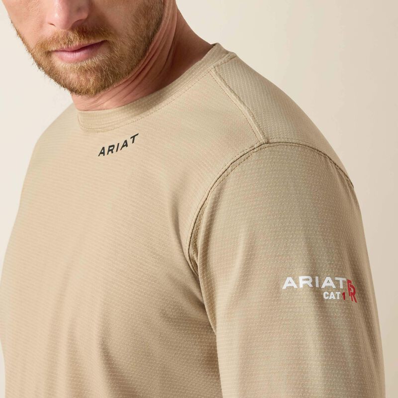 Sideview closeup of a man wearing Ariat Baselayer T-shirt in beige