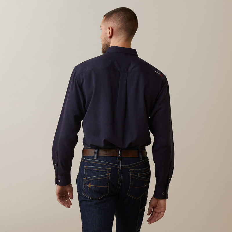 Back view of a man wearing Ariat FR ultralight work shirt in navyheather