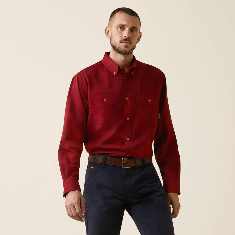 Front view of a man wearing Ariat FR ultralight work shirt in red heather