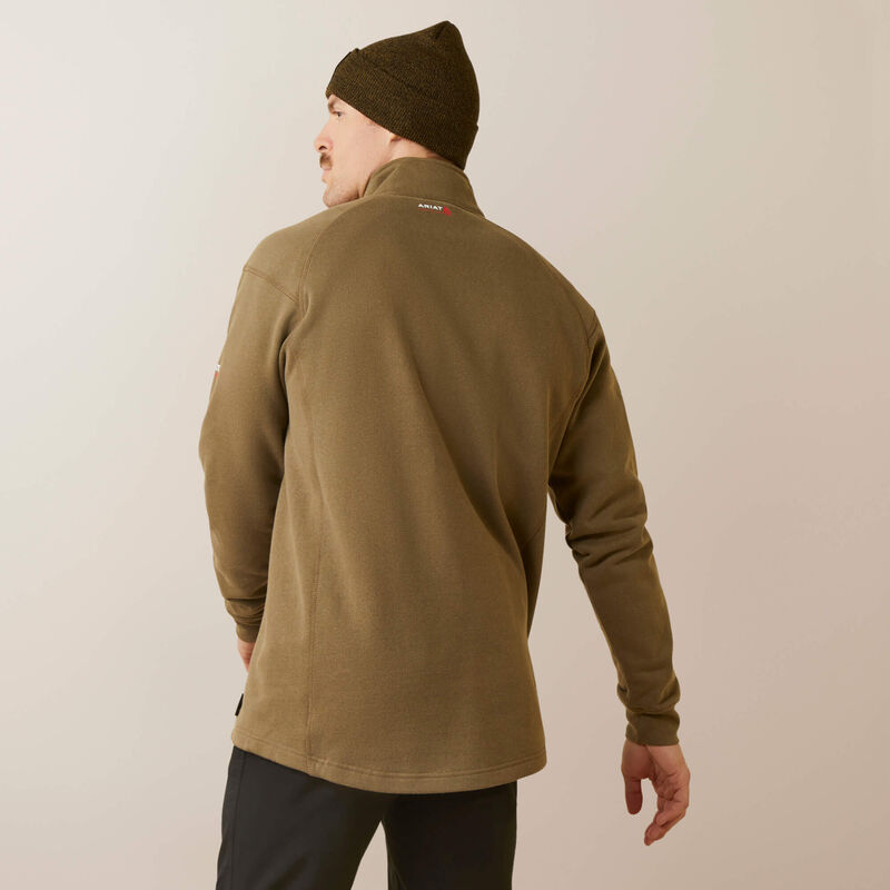 Back view of a man wearing ariat 1/4 zip FR pullover in brown