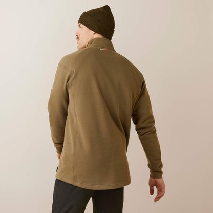 Back view of a man wearing ariat 1/4 zip FR pullover in brown