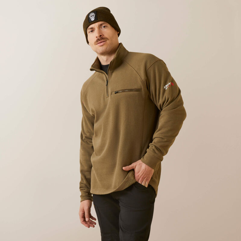 A man wearing ariat 1/4 zip FR pullover in brown