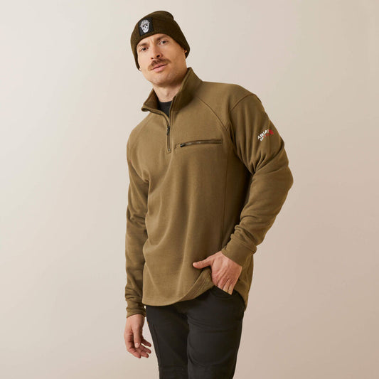 A man wearing ariat 1/4 zip FR pullover in brown