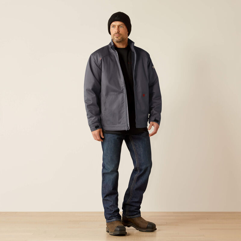 A man wearing Ariat FR insulated jacket in grey