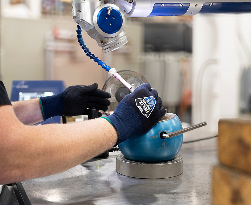  A person performing some task wearing HexArmor A1 eco-friendly work gloves 