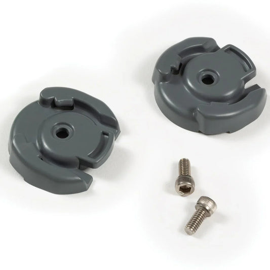 Two gray plastic components with two screws on a white background