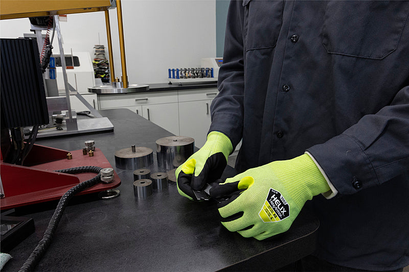 A person performing some task wearing HexArmor A9 Cut Resistant Gloves