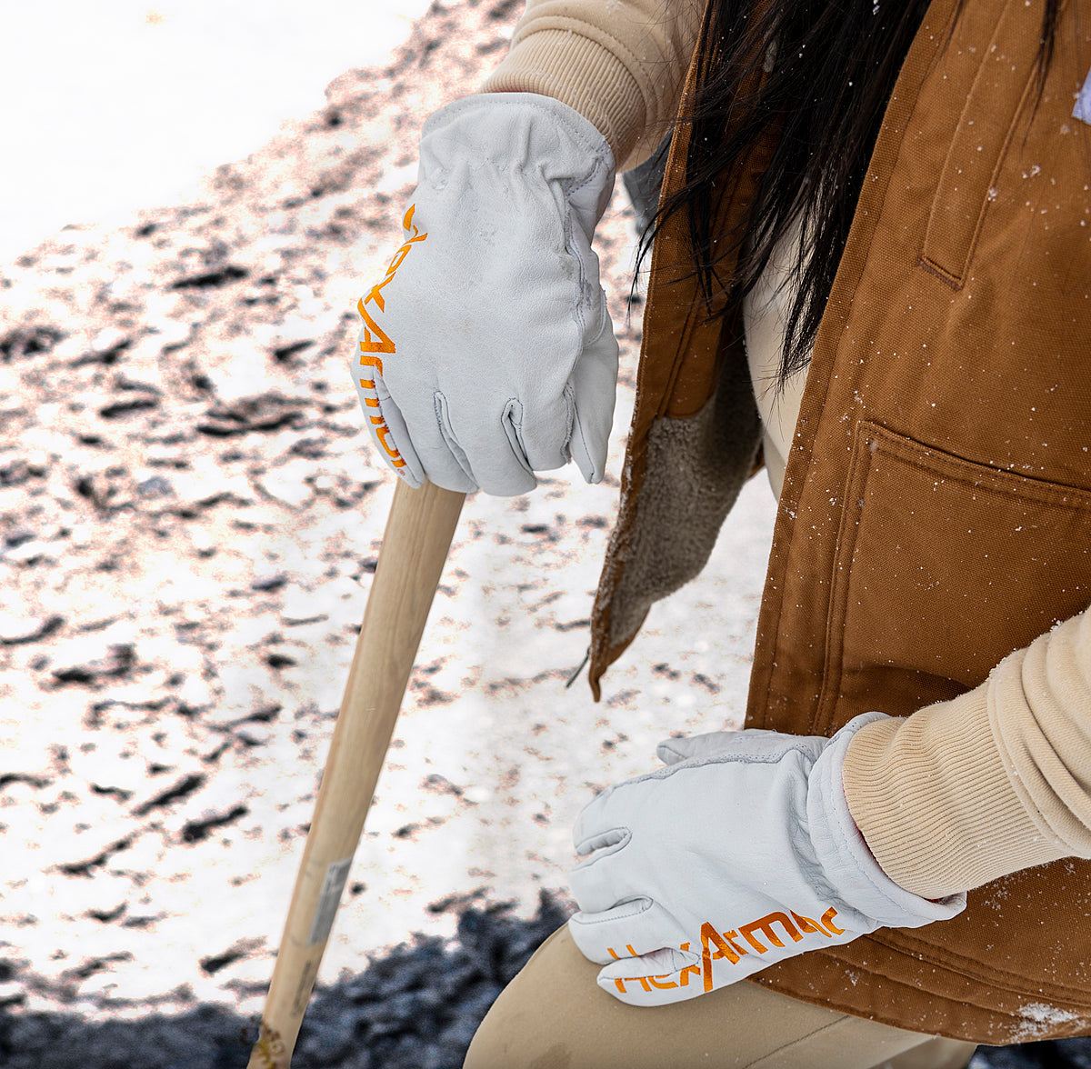 A person wearing HexArmor cut resistant gloves in white