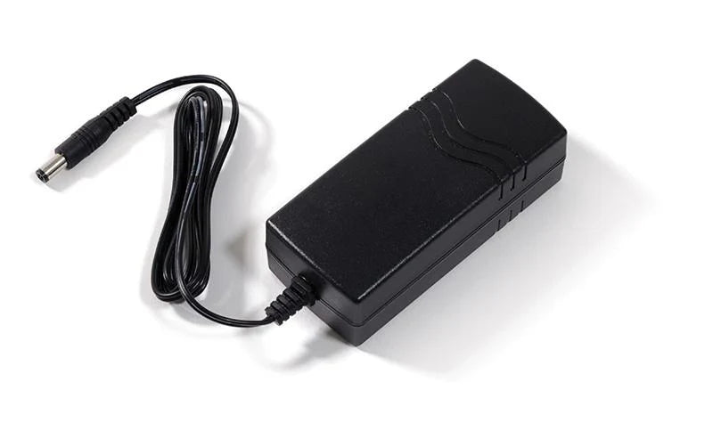 Black power adapter with cable on a white background
