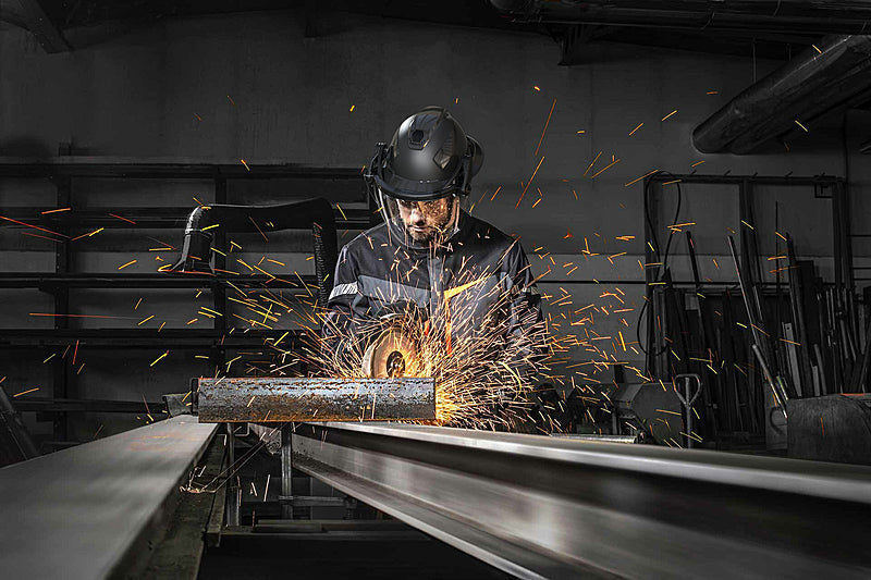 Man performing task wearing HexArmor TruSpan Face Shield on safety helmet